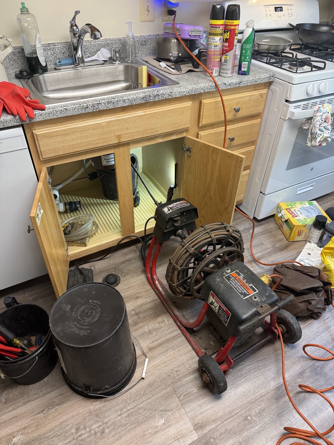 DrainWorks technician performing drain cleaning service