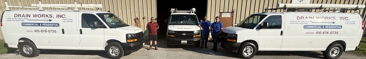 DrainWorks team with service van